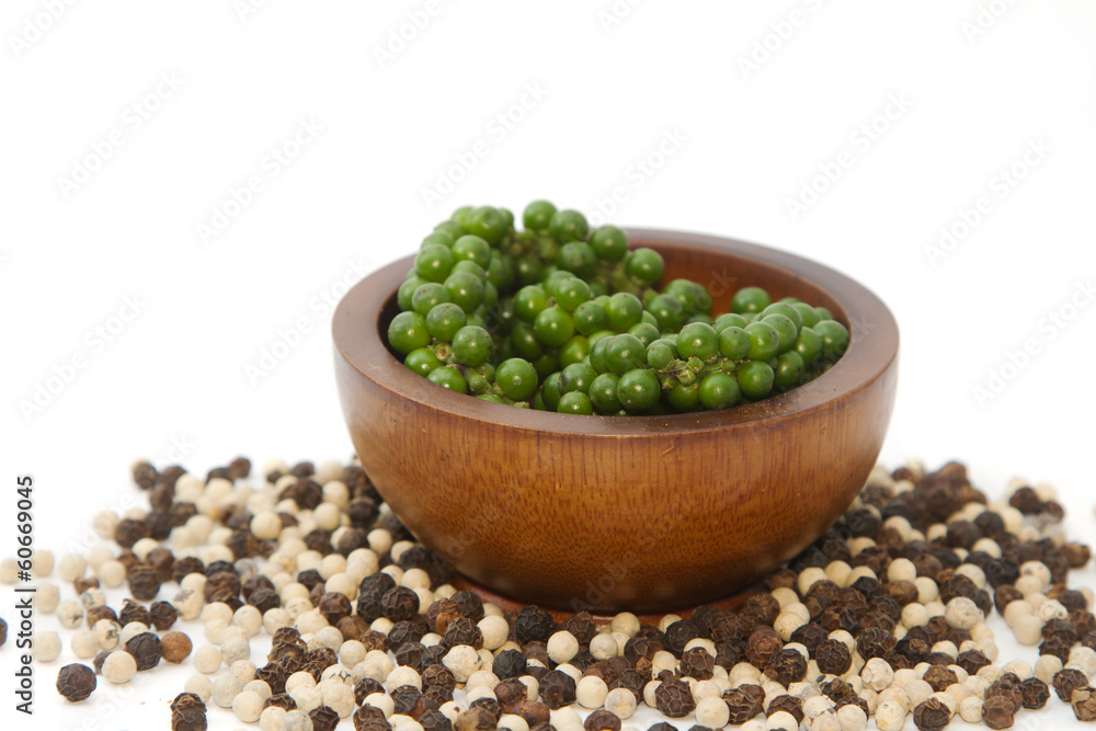 Fresh green pepper on heap of black and white pepper,Thai spice Fresh green pepper on heap of black and white pepper,Thai spice