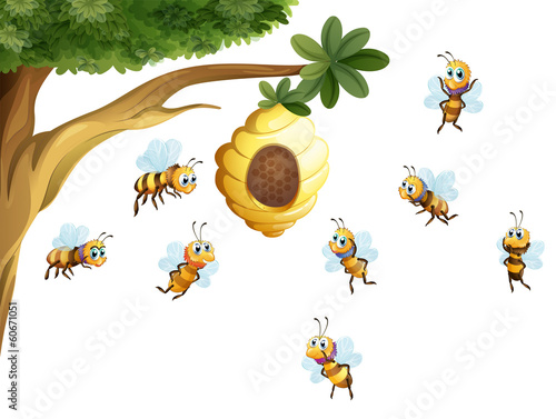 A tree with a beehive surrounded by bees