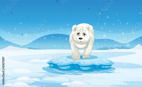 A sad polar bear standing above the iceberg