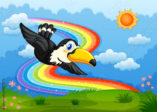 A bird in the sky with a rainbow