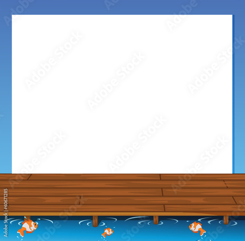 An empty paper template with a wooden bridge and fishes at the b