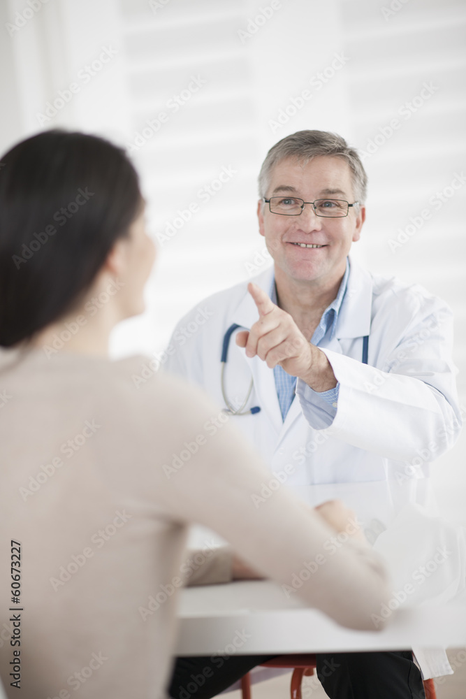 senior doctor consulting female patient senior doctor consulting female patient