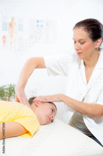 Chiropractor doing adjustment on female patient