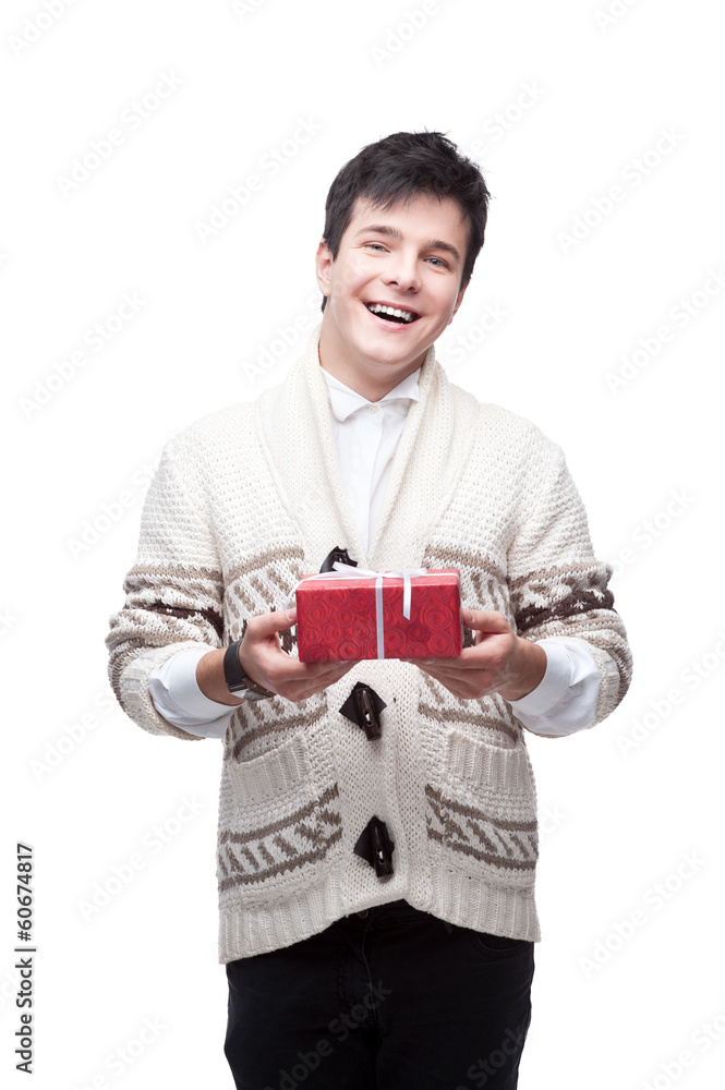 caucasian smiling casual young man holding gift caucasian smiling casual young man holding gift