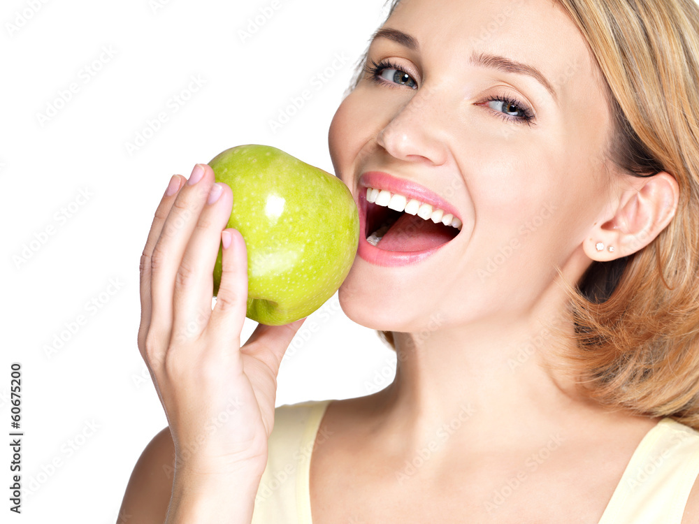 Beautiful young woman biting the biting a fresh ripe apple Beautiful young woman biting the biting a fresh ripe apple