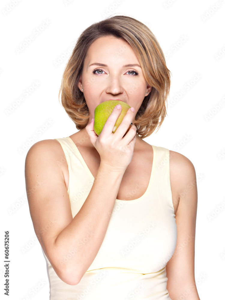 Beautiful young woman biting the biting a fresh ripe apple Beautiful young woman biting the biting a fresh ripe apple