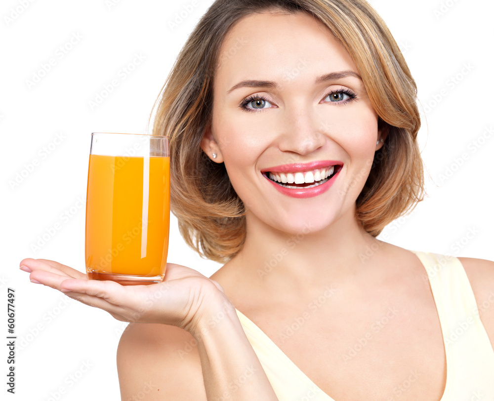 Portrait of a beautiful young woman with a glass of juice. Portrait of a beautiful young woman with a glass of juice.