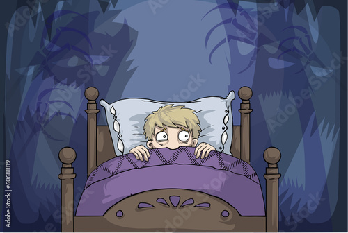 boy in bed having nightmares