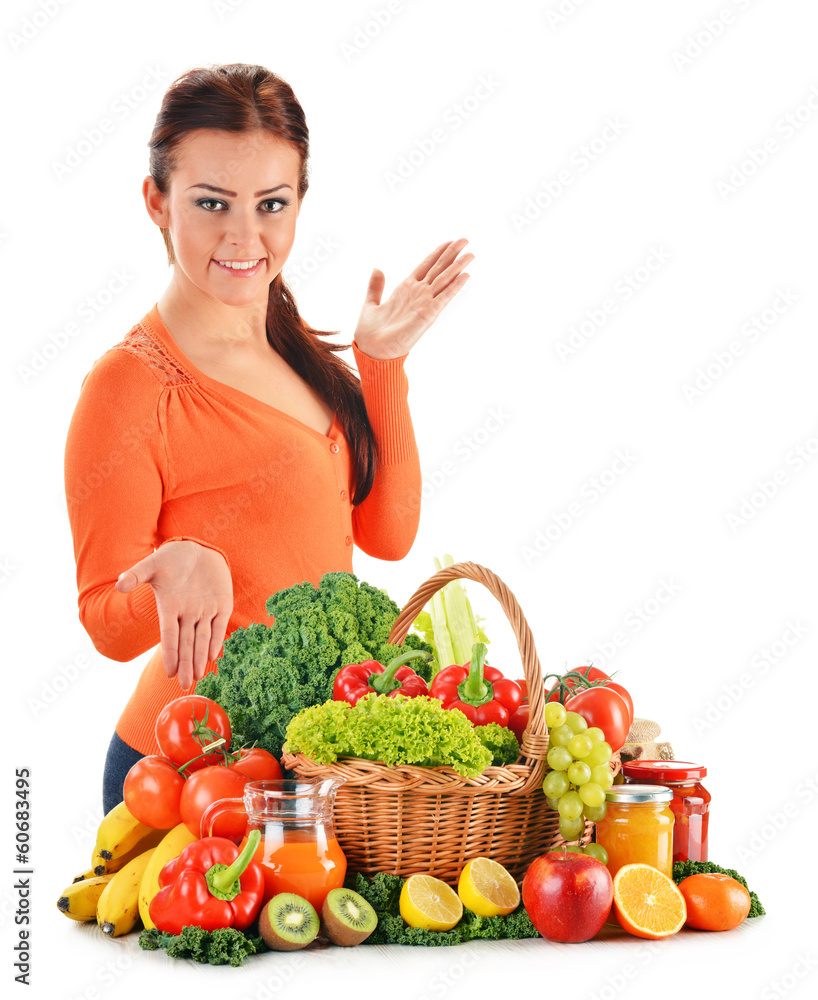 Young woman with assorted vegetables isolated on white Young woman with assorted vegetables isolated on white