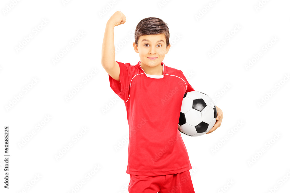 Young boy in sportswear holding soccer ball and gesturing with h Young boy in sportswear holding soccer ball and gesturing with h