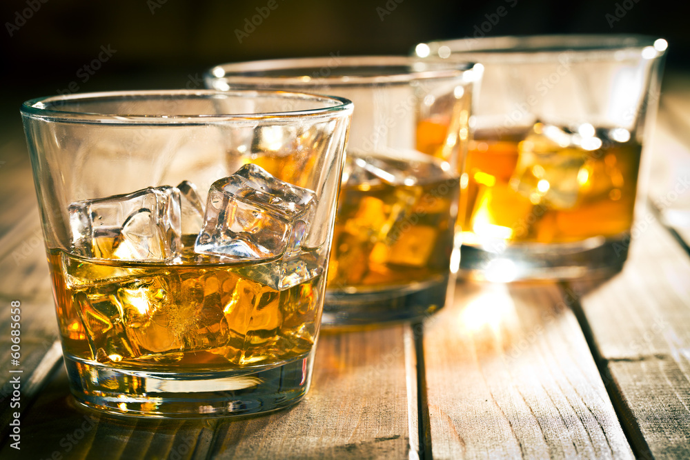 whiskey in glass with ice whiskey in glass with ice