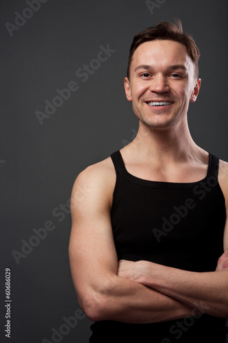 Young man with crossing arms