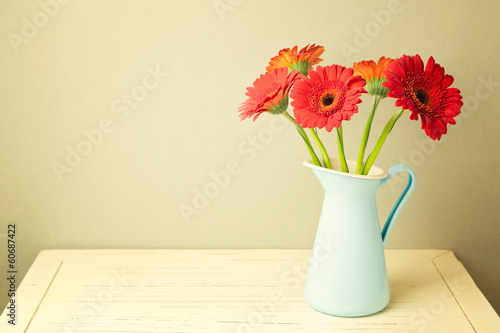 Fototapeta Naklejka Na Ścianę i Meble -  Gerbera daisy flowers on wooden white table