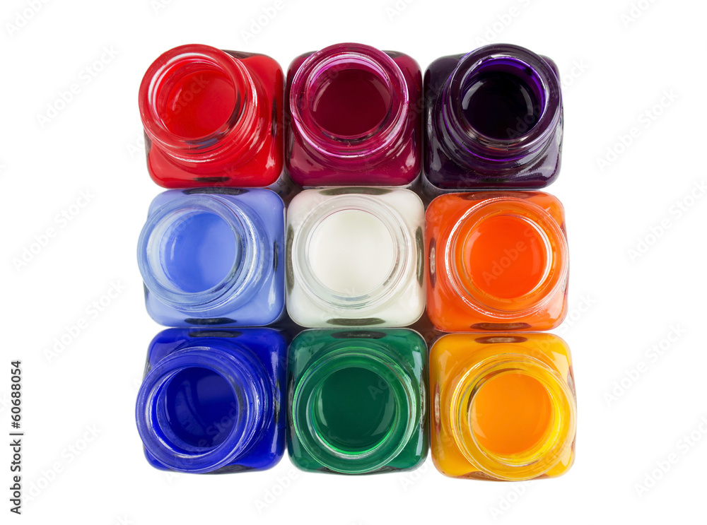 A set of acrylic paint in bottles on white background A set of acrylic paint in bottles on white background