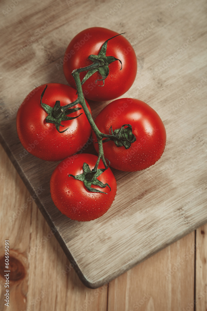 Tomatos on cutting board Tomatos on cutting board