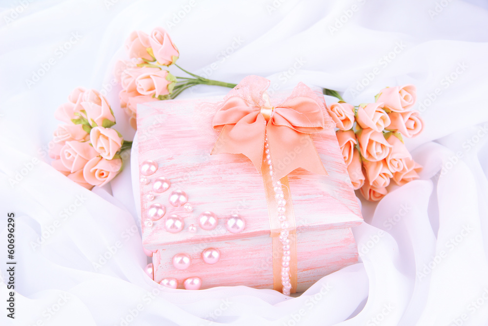 Beautiful hand made casket and flowers, isolated Beautiful hand made casket and flowers, isolated