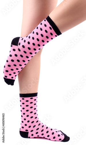 Female legs in colorful socks, isolated on white