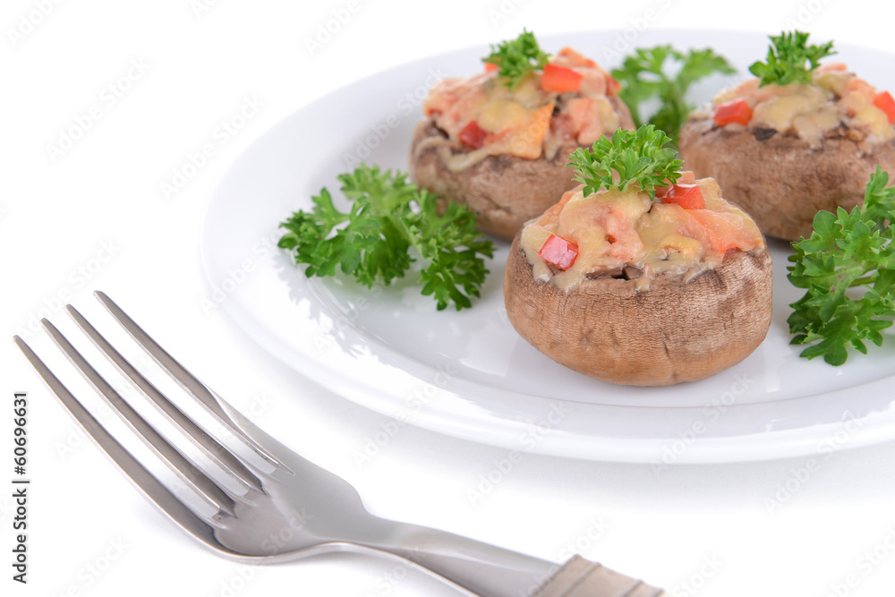 Stuffed mushrooms on plate isolated on white Stuffed mushrooms on plate isolated on white