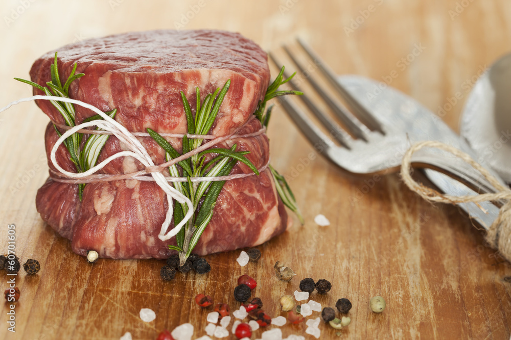 fresh raw beef fillet mignon on old wooden background fresh raw beef fillet mignon on old wooden background