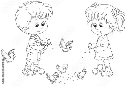 Boy and girl feed birds