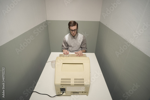 Vintage nerd on computer photo