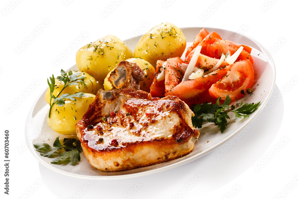 Grilled steak, boiled potatoes and vegetable salad Grilled steak, boiled potatoes and vegetable salad