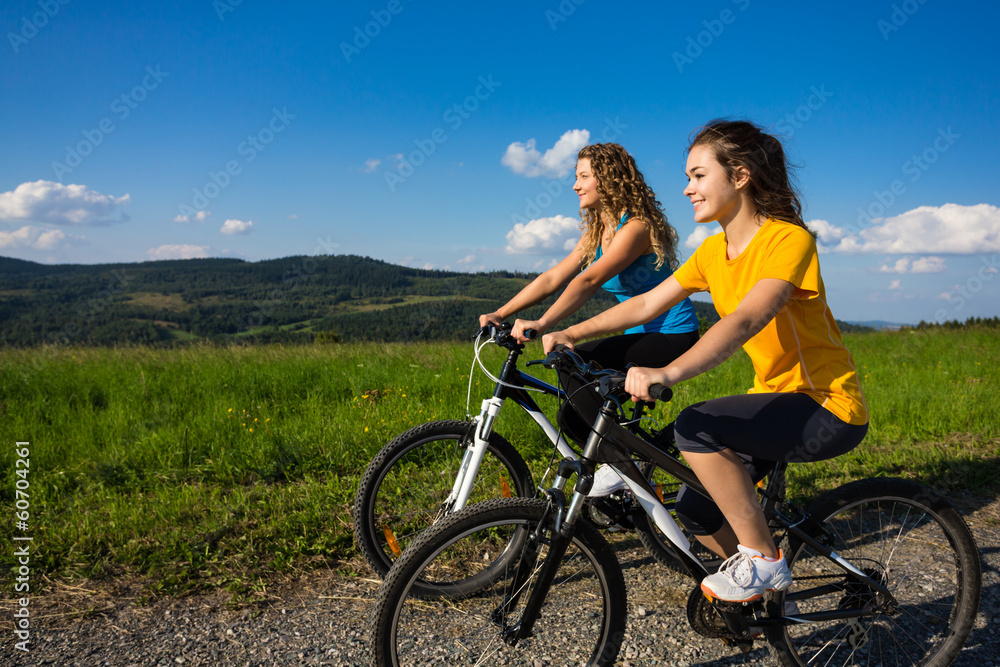 Healthy lifestyle - young women biking Healthy lifestyle - young women biking