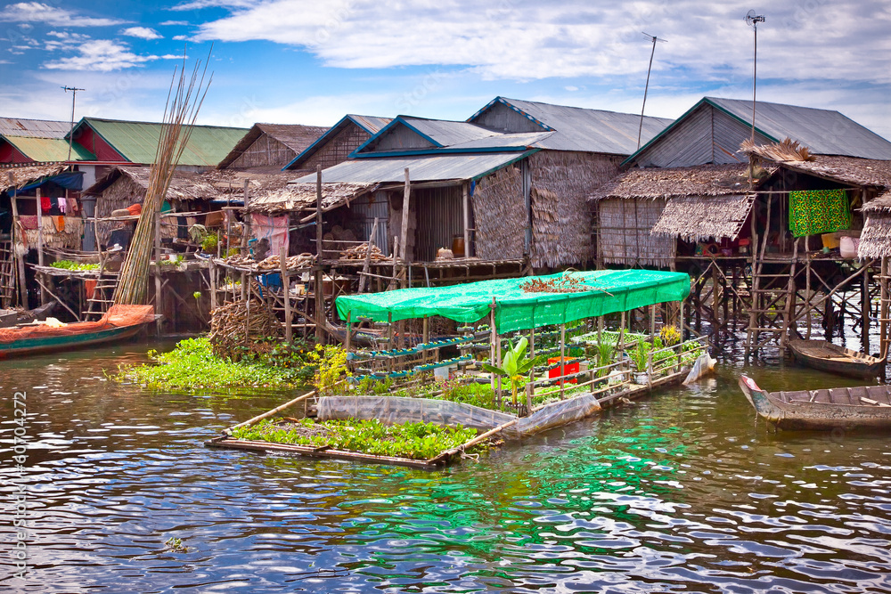 The floating village on the water of Tonle Sap lake. Cambodia. The floating village on the water of Tonle Sap lake. Cambodia.