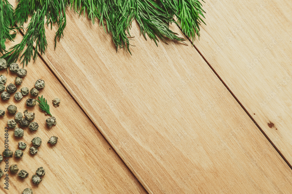 Wood background with dill and pepper frame Wood background with dill and pepper frame