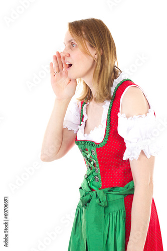Bavarian woman in red dirndl is yodelling