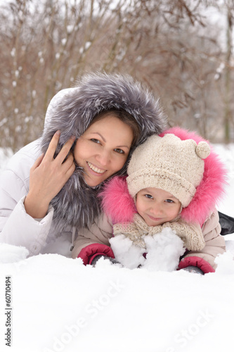 Mother and daughter in the snow.