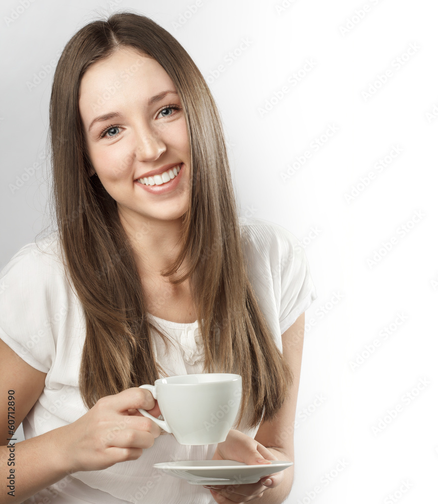 Young beautiful woman holding a mug of coffee Young beautiful woman holding a mug of coffee