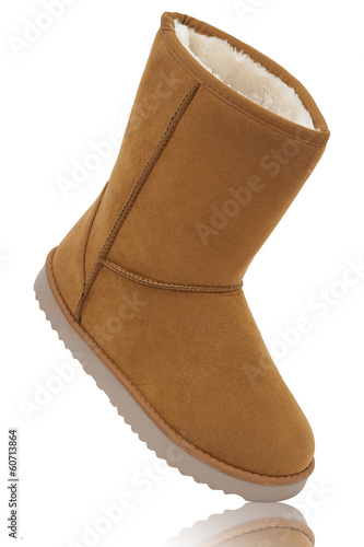 UGG, womens sheepskin boots isolated on white photo