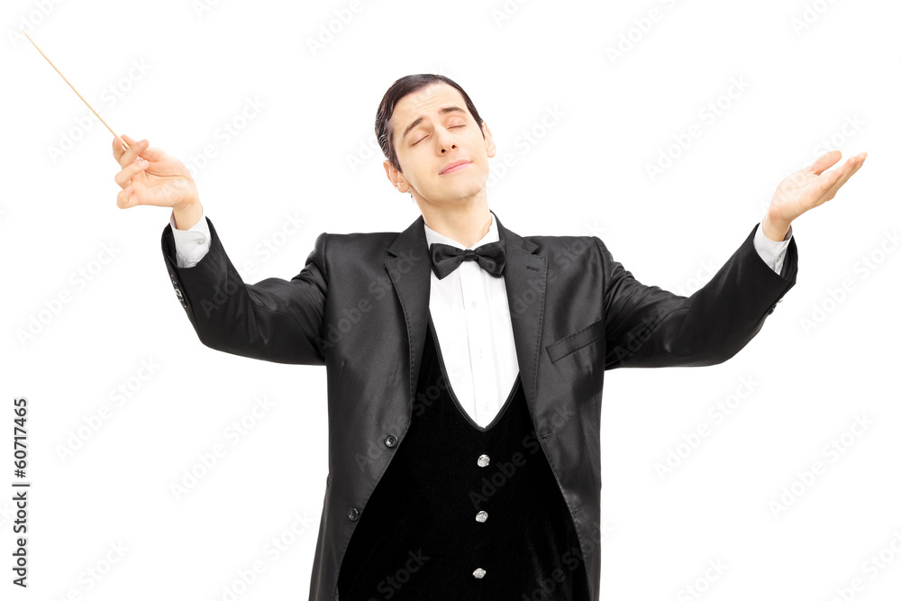 Male orchestra conductor directing with baton Male orchestra conductor directing with baton