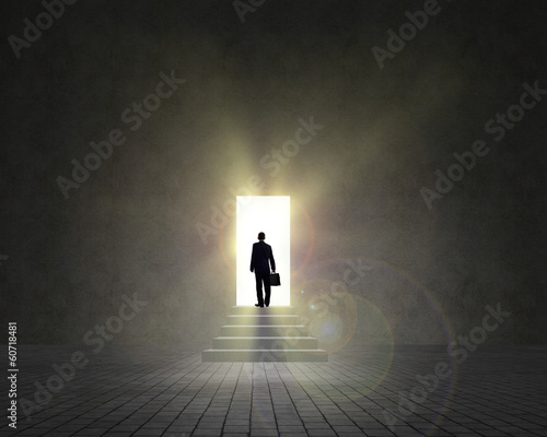 business man standing near an open door © adam121
