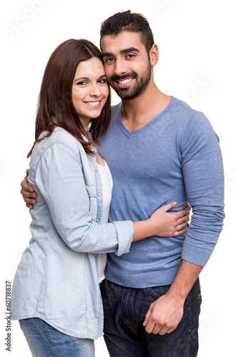 Couple posing over white background