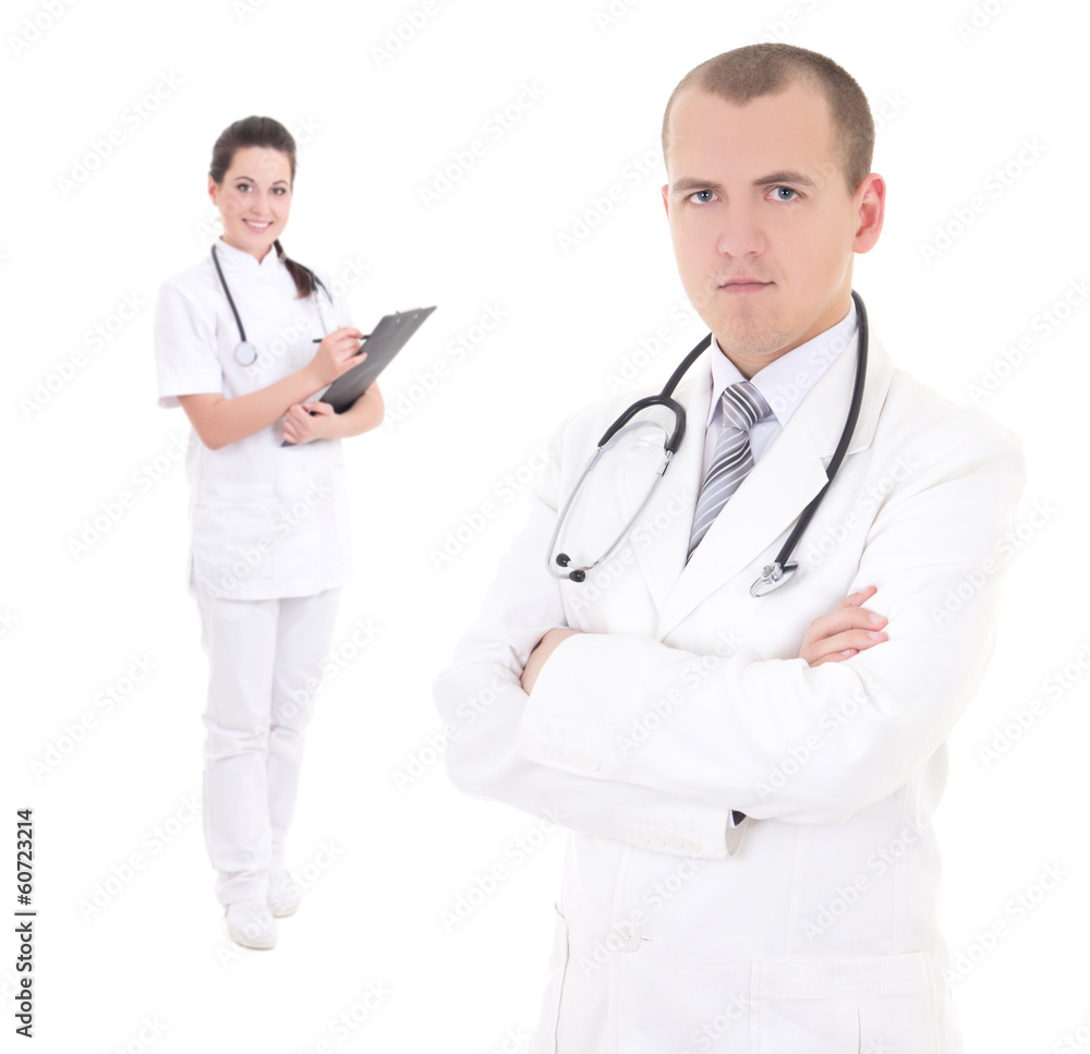 young male doctor and female nurse isolated on white young male doctor and female nurse isolated on white