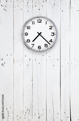 Clock on a bright wooden wall