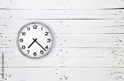Clock on a white wooden wall