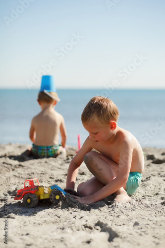 Two children playing on the beach