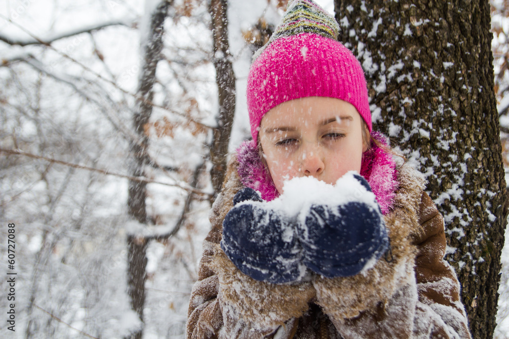 Little girl with snow in hands Little girl with snow in hands