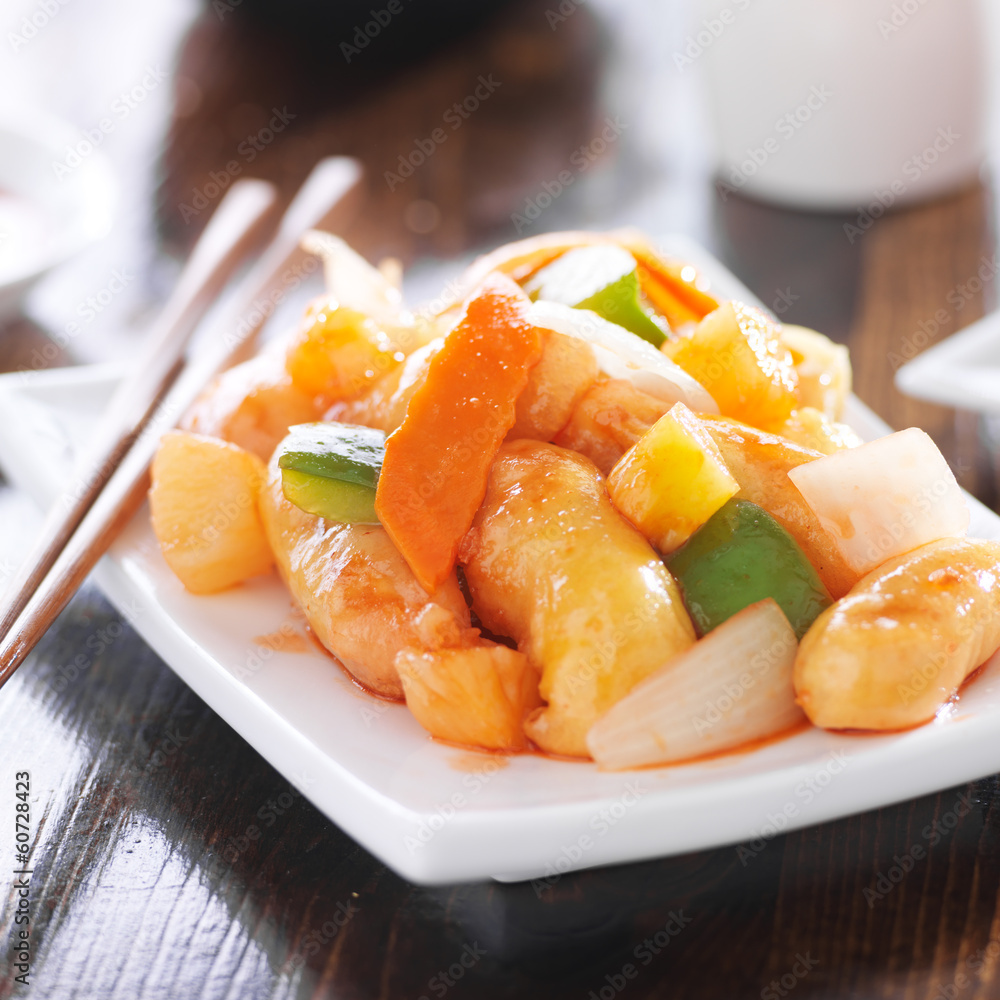 chinese sweet and sour chicken with chopsticks