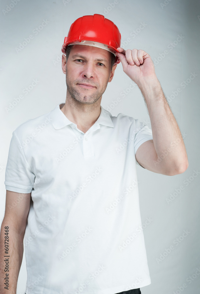 Portret of worke  man in red helmet