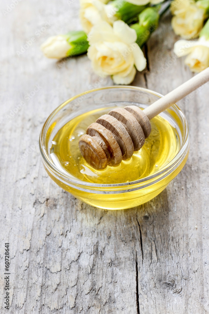 Bowl of honey on wooden table Bowl of honey on wooden table