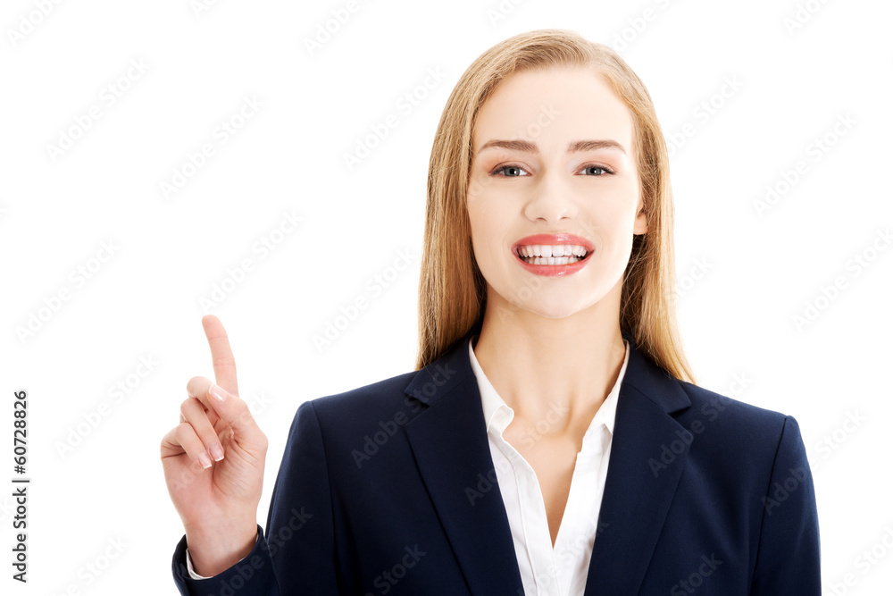 Beautiful business woman pointing on copy space. Beautiful business woman pointing on copy space.