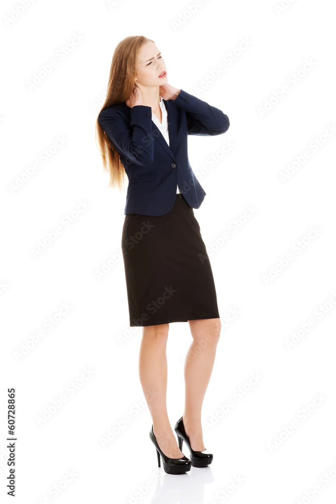Beautiful caucasian business woman is touching her neck. Beautiful caucasian business woman is touching her neck.