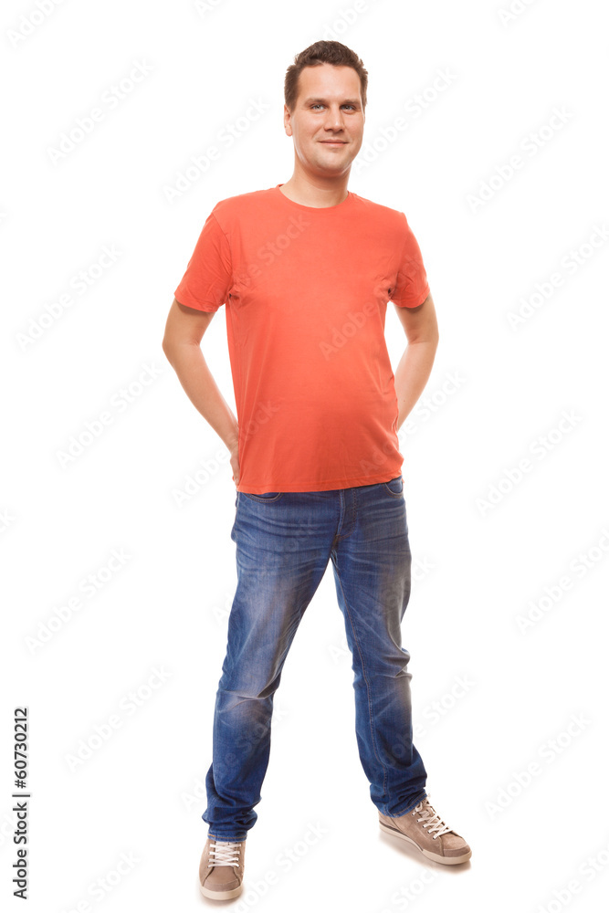 Young man guy red t-shirt jaens with hands in pockets isolated Young man guy red t-shirt jaens with hands in pockets isolated
