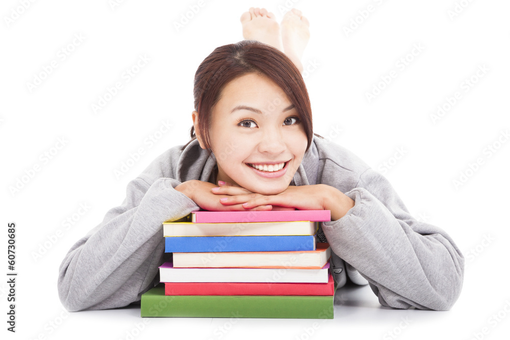 asian young  student lying on stacked books