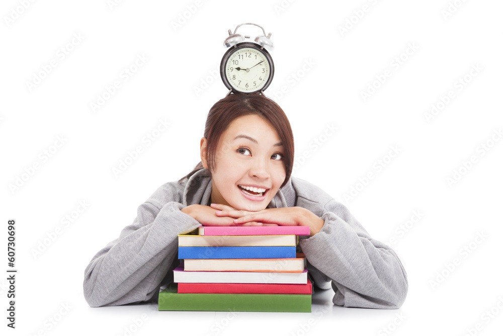 happy young student looking clock with books happy young student looking clock with books