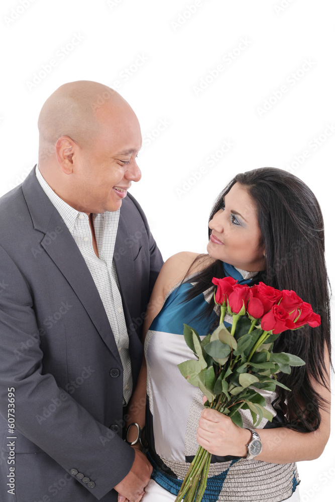 young couple with bouquet of roses looking at each other young couple with bouquet of roses looking at each other